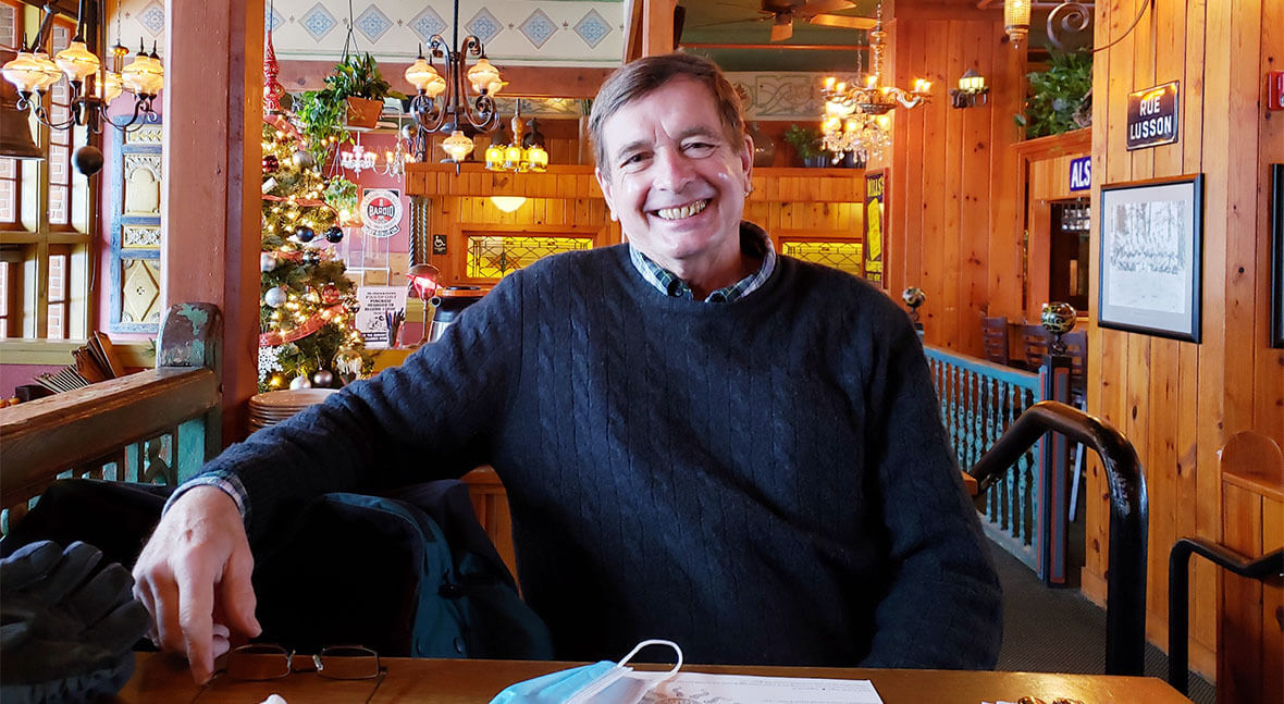 Doug Olson sits at a table in a restaurant where he celebrated his birthday.