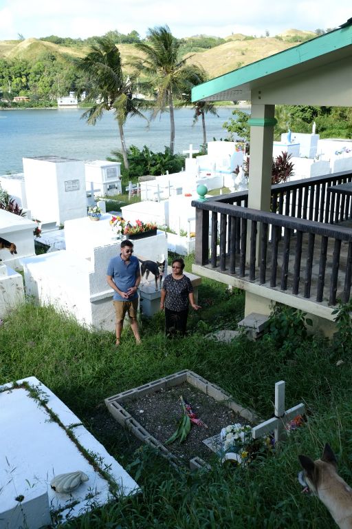 Writer Steve Graff visits Umatac Cemetery in Guam with Lucy Cruz, a local nurse whose mother died of lytico-bodig disease.